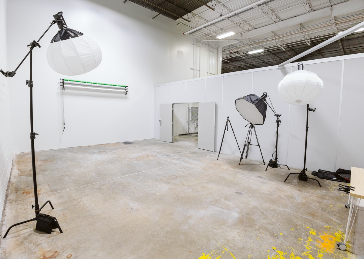 Photo of open content studio with lights and roll down back ground for photography and videography production